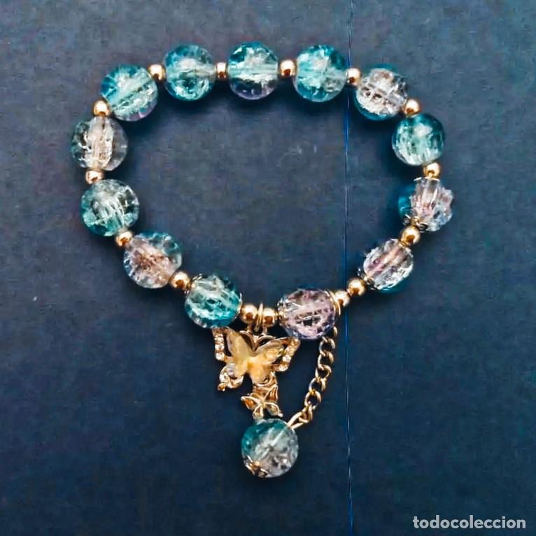 Joyeria: PULSERA ELASTICA PIEDRAS SWAROSKI BOLAS AZULES CON DIJET MARIPOSA Y ALPACA PLATEADA