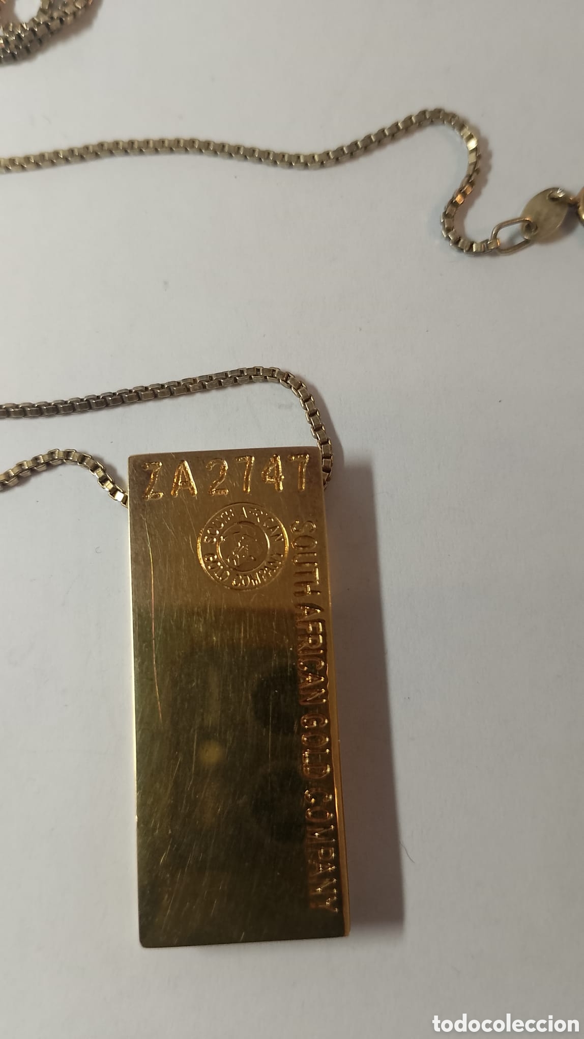 Joyeria: Colgante lingote de oro.