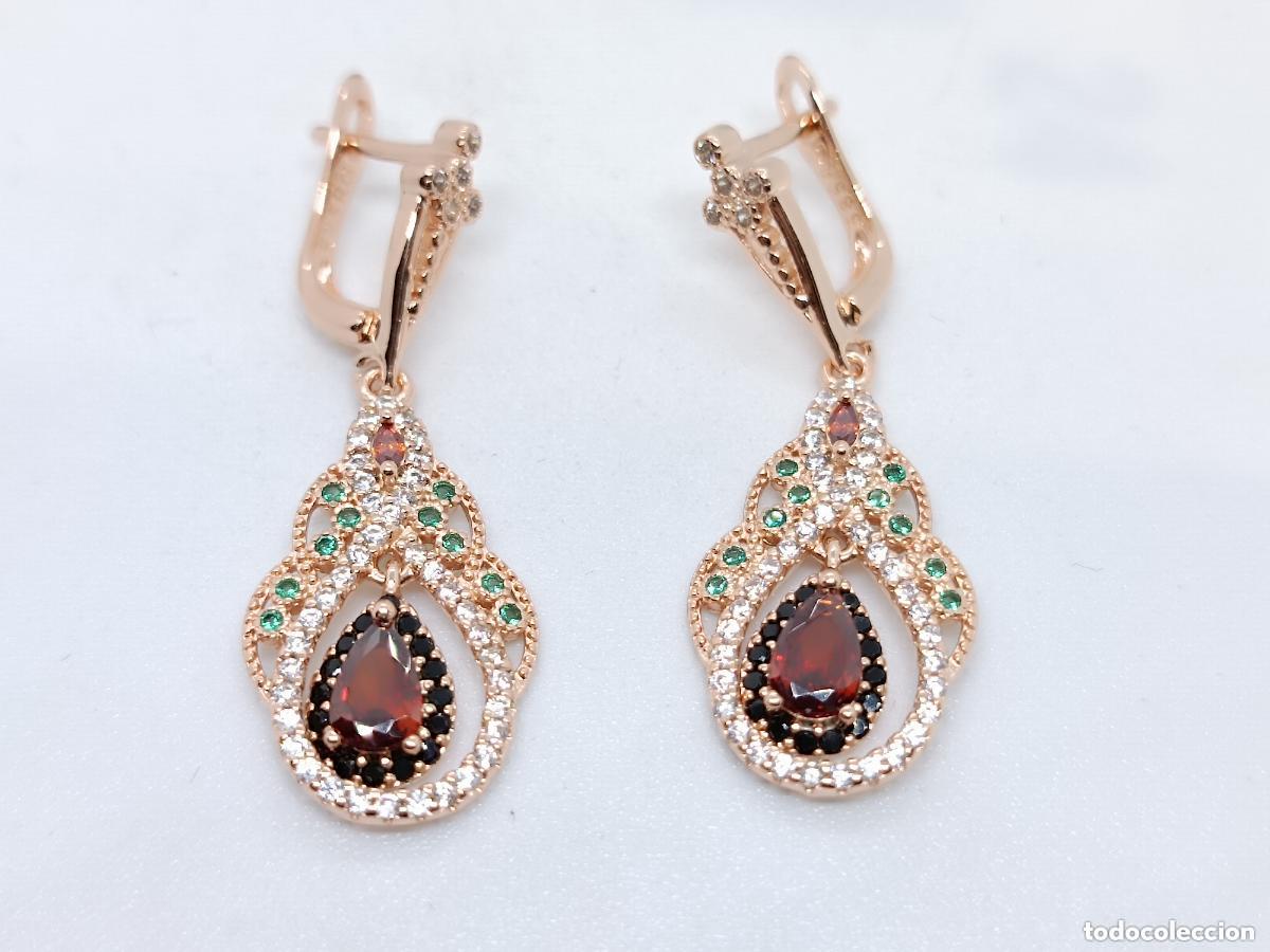 Joyeria: Maravillosos pendientes en oro de 14k contrastados con granates tallados
