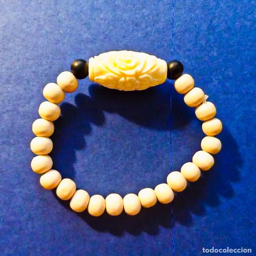 Joalharia: PULSERA ELASTICA DE BOLAS DE MADERA CREMA CON DIGET