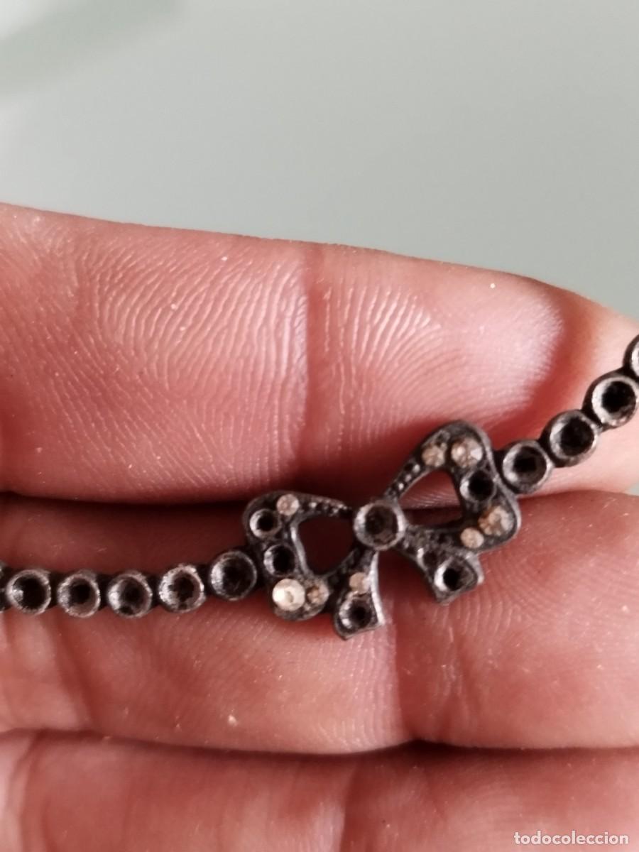 Joyeria: Antiguo colgante, adorno en forma de lazo.
