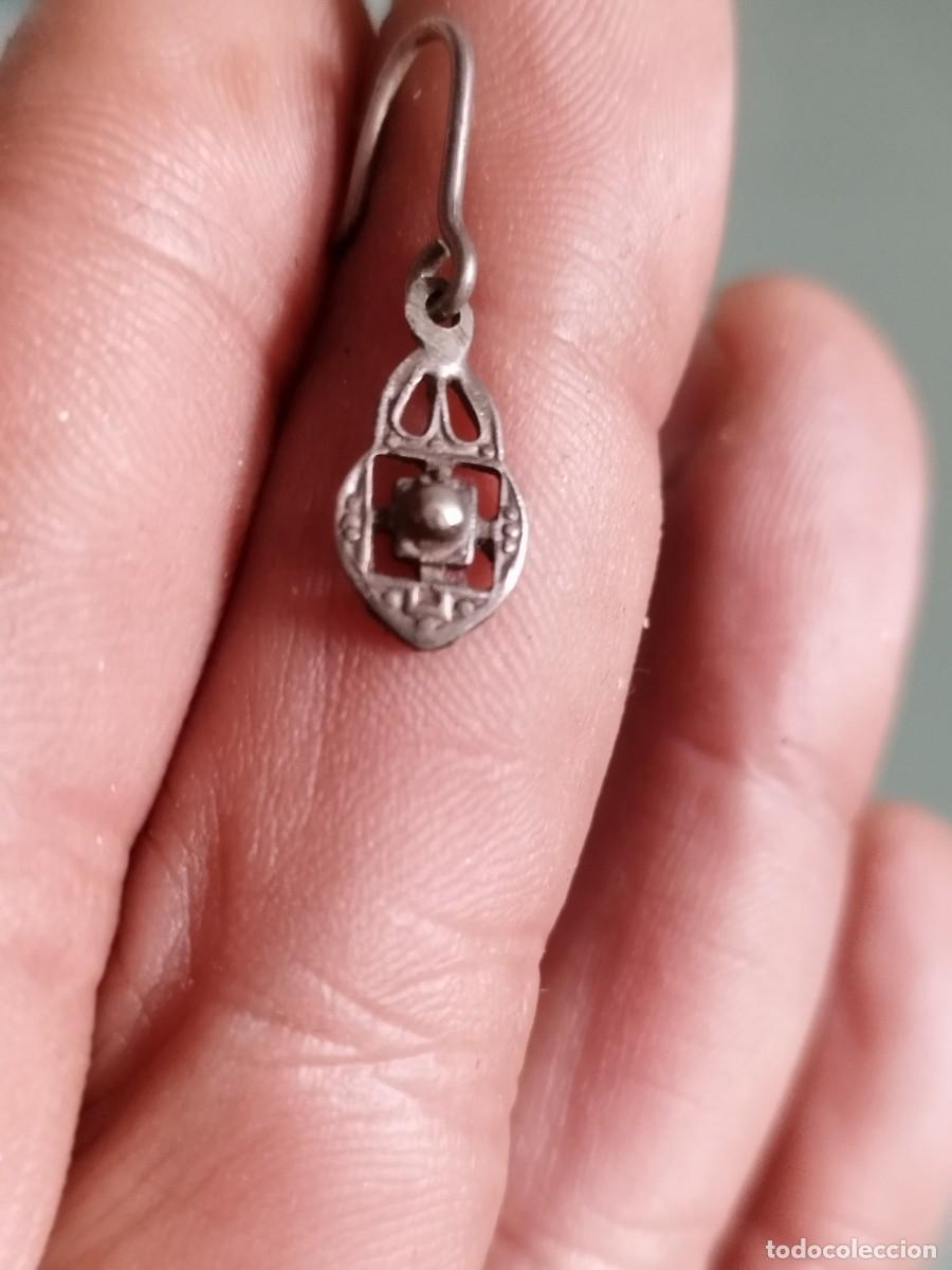 Joyeria: Antiguo pendiente a identificar.