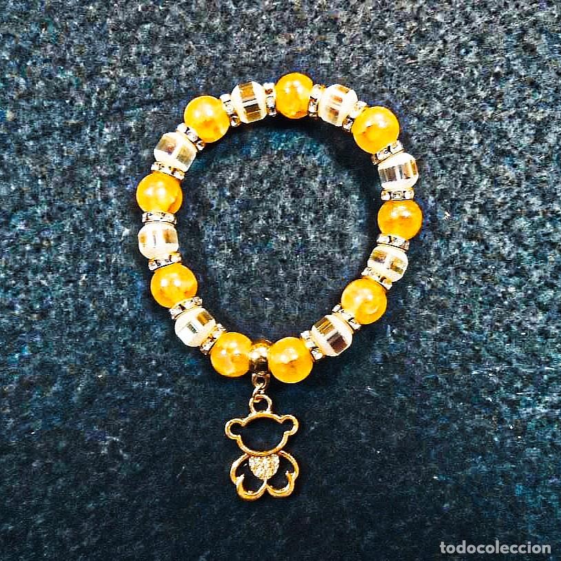 Joyeria: PULSERA ELASTICA DE BOLAS 10 MM CON AGATAS AMARILLAS Y SWAROSKI CON DIGET OSO TOUS