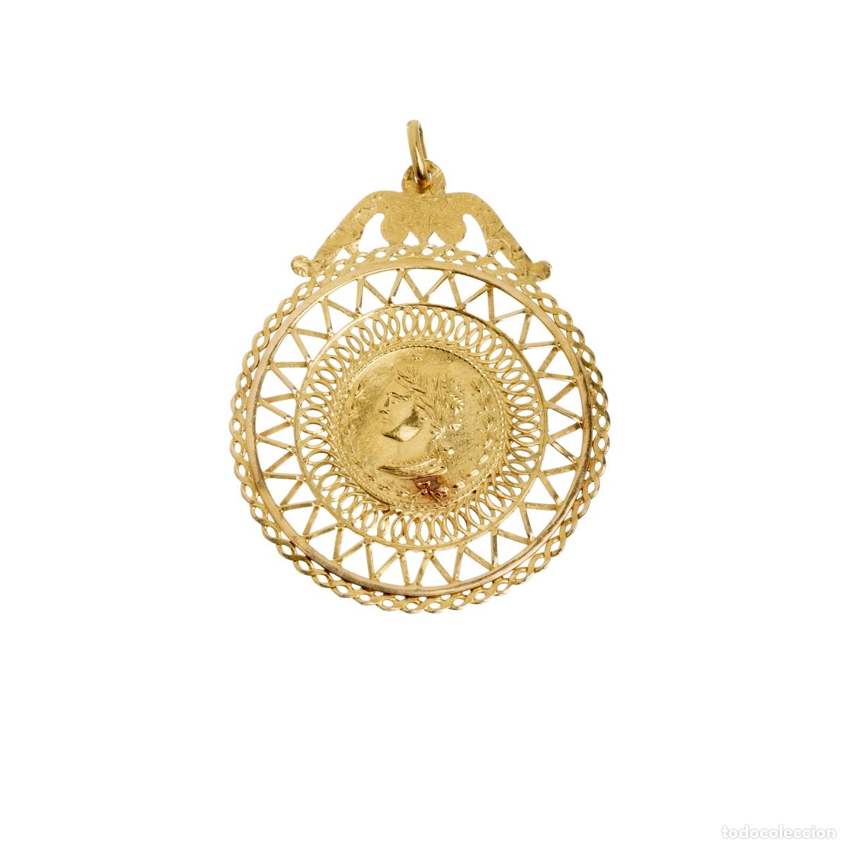 Gioielleria: Colgante en oro de 19,2 quilates