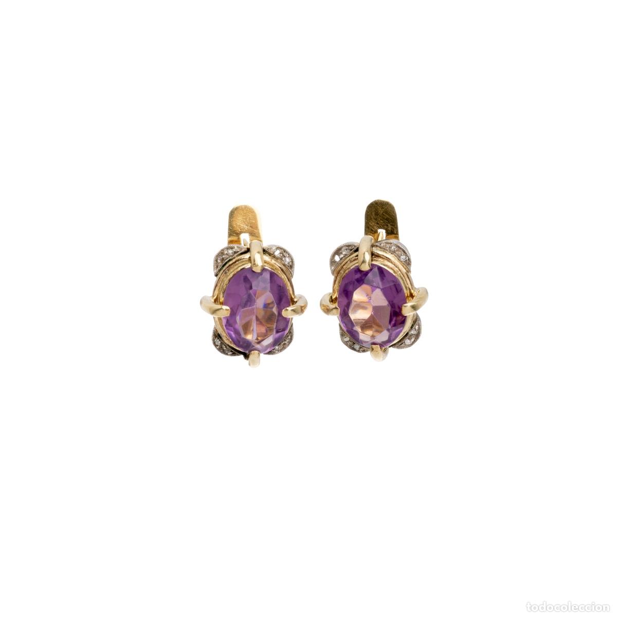 Joaillerie: Par de pendientes de plata y oro.