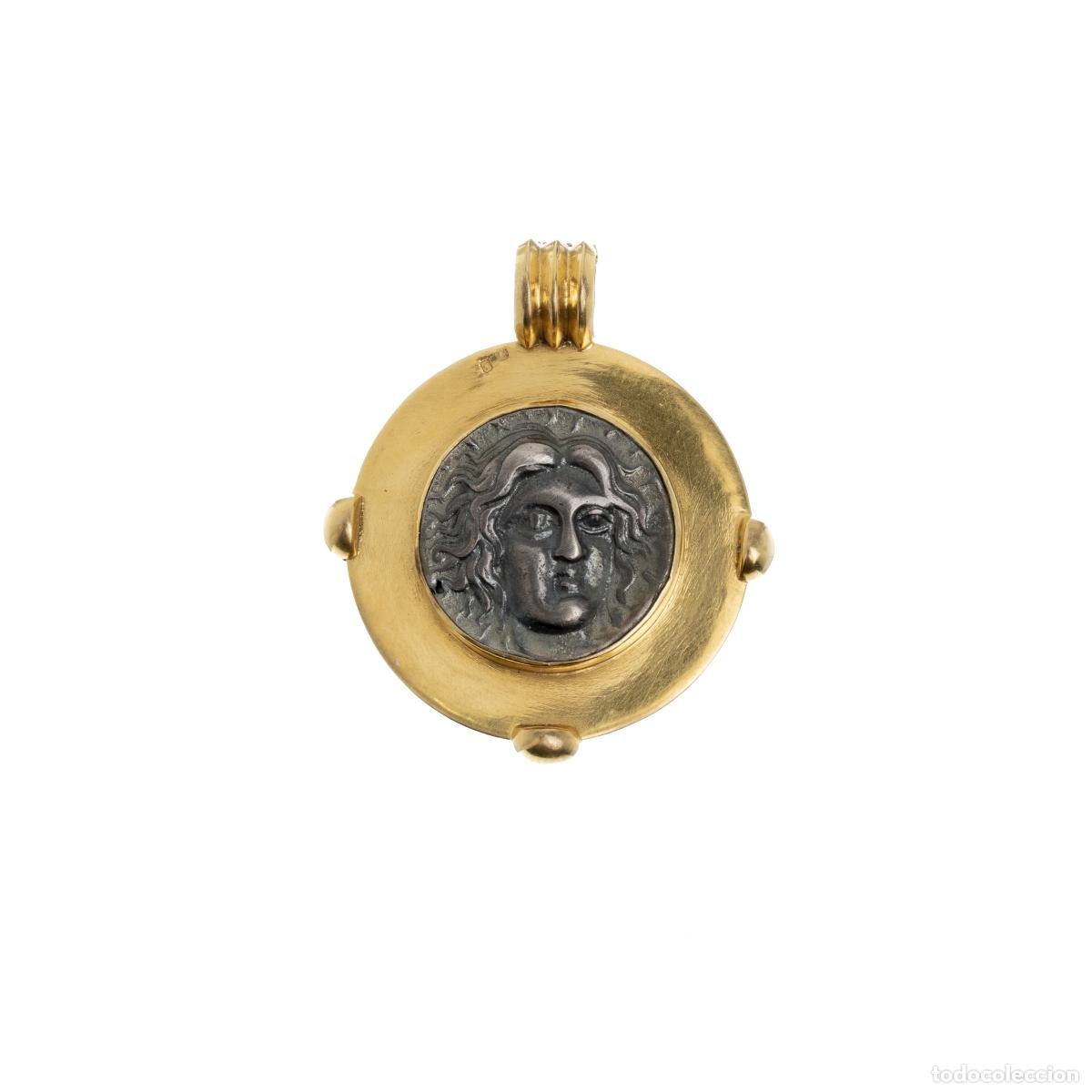 Joaillerie: Colgante de plata y oro.