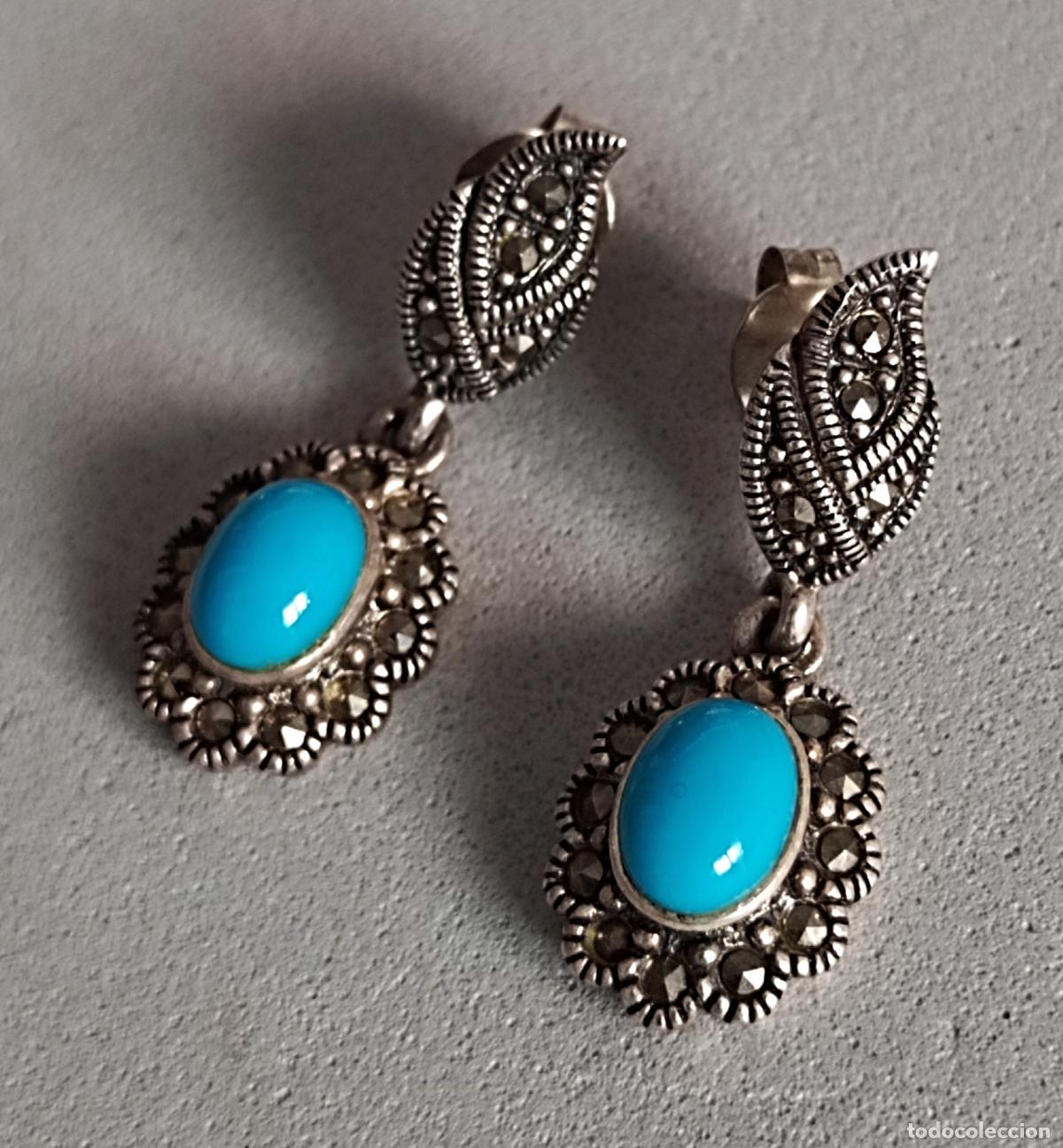 Joyeria: Pendientes de plata de ley contrastada con piedra azul y marcasitas. Cierre de presi&oacute;n.