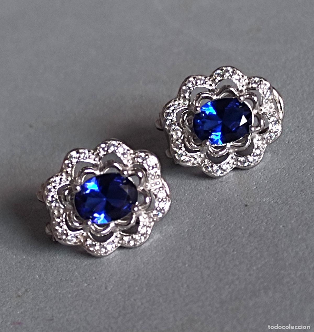 Joyeria: Pendientes plata de ley contrastada, con piedra azul, cierre de omega.