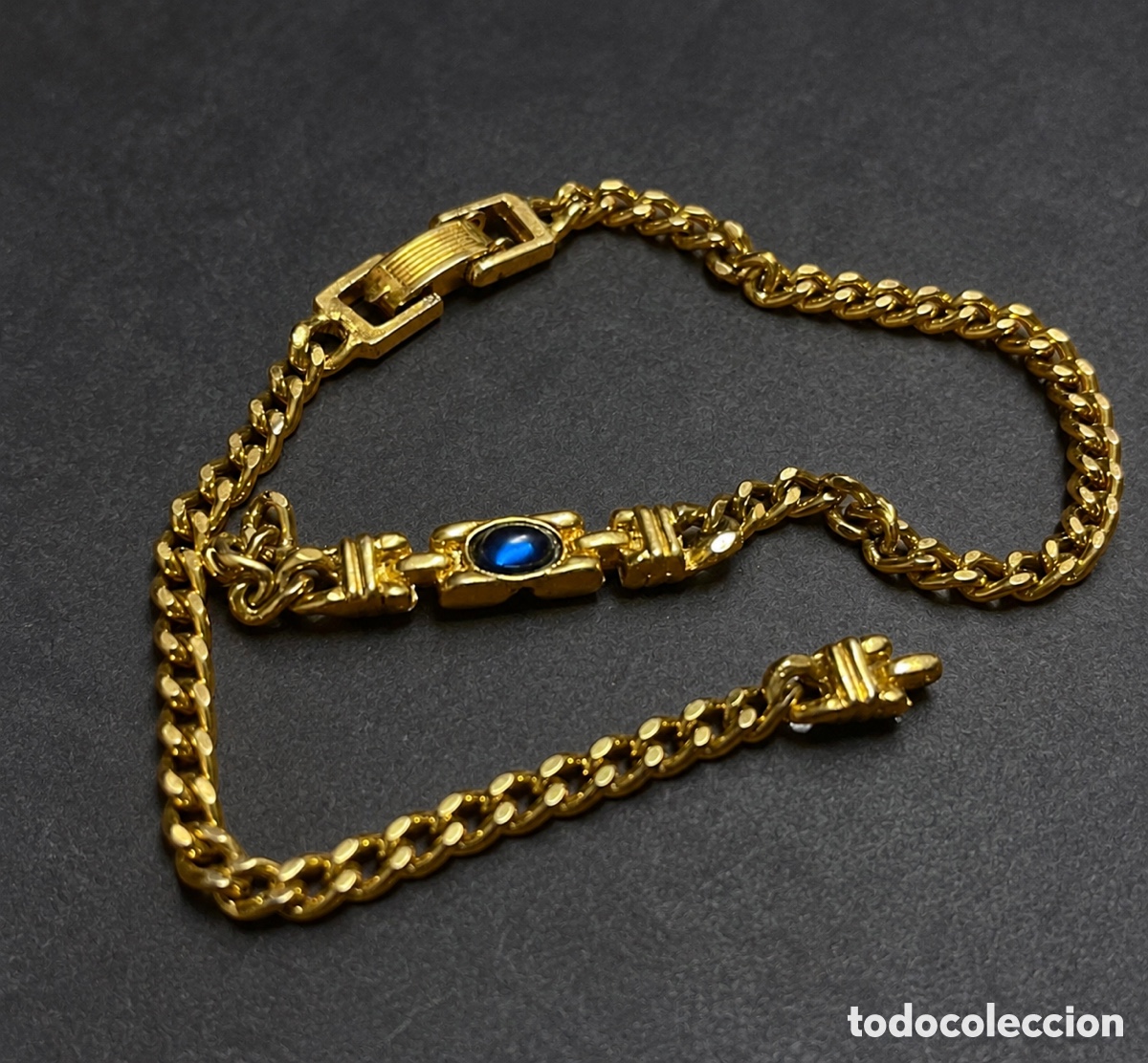 Joalharia: Descripci&oacute;n '''Pulsera vintage dorada con piedra azul - dise&ntilde;o cl&aacute;sico a&ntilde;os 70, cierre artesanal