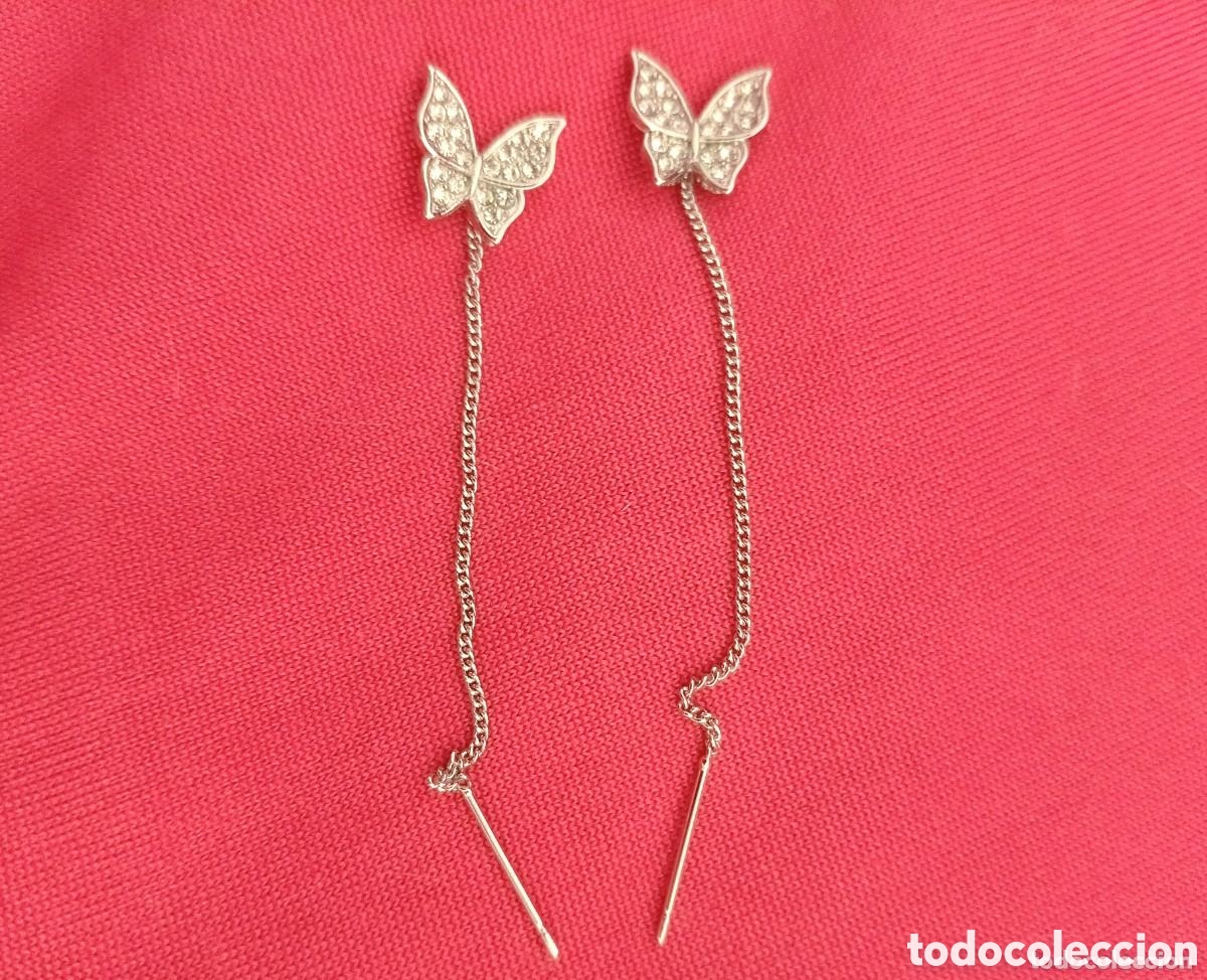 Gioielleria: Originales pendientes mariposa plateados con tachuelas brillantes largo infinito 6cm L. aprox....