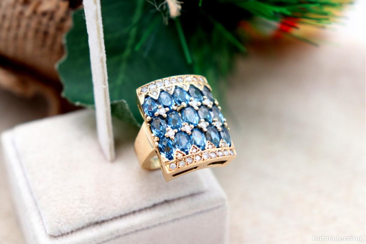 Joalharia: Anillo de oro de 18 quilates con diamantes y piedras de topacio
