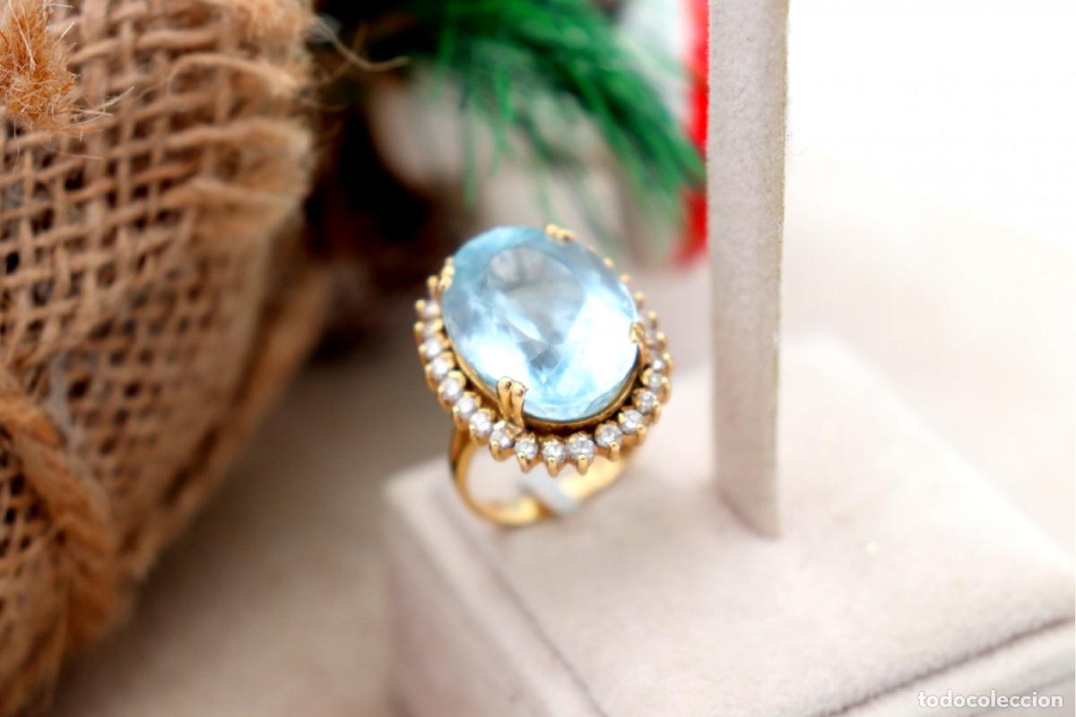 Joalharia: Anillo de oro de 19,2 quilates con diamantes y topacios