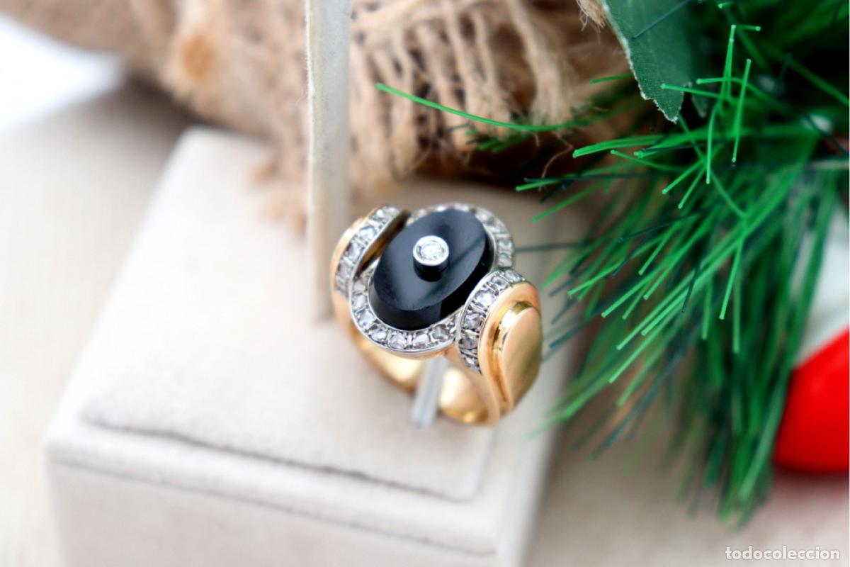 Joyeria: Anillo de oro de 19,2 quilates con diamantes y &oacute;nix