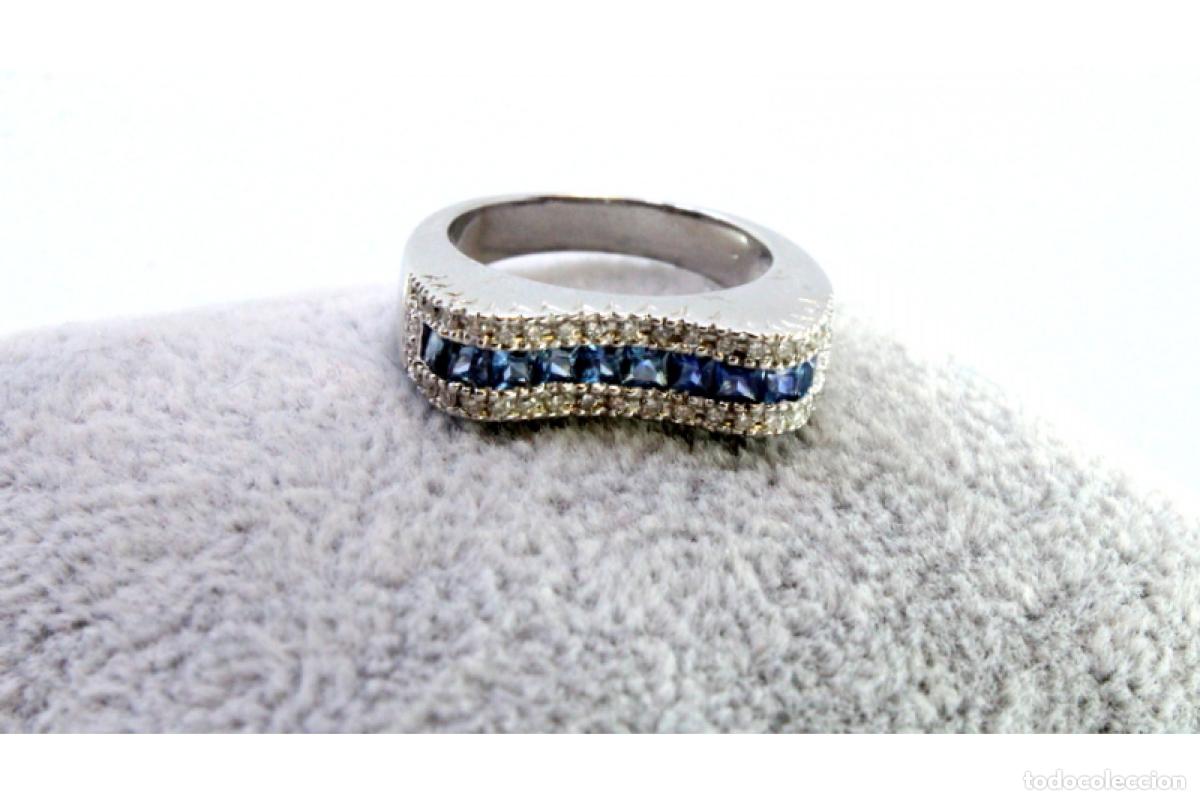 Joyeria: Anillo de oro de 19,2 quilates con diamantes y topacios