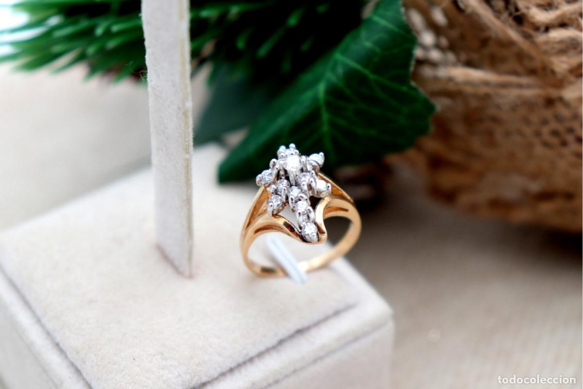 Joyeria: Anillo de oro bicolor con diamantes.