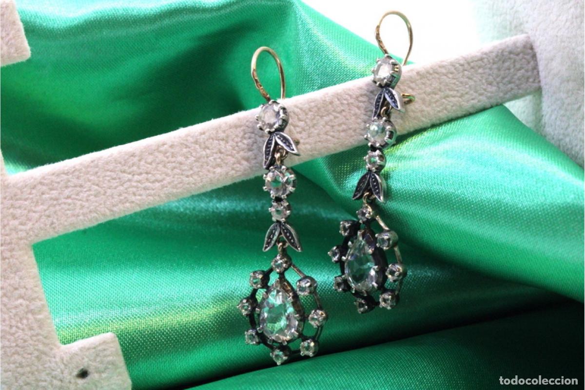 Joaillerie: Pendientes en oro y plata de 19,2K.