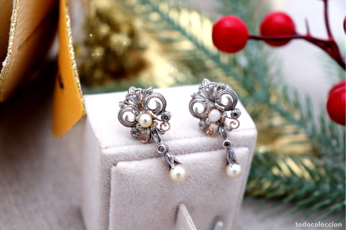 Joaillerie: Pendientes en oro de 19,2K y plata con diamantes.