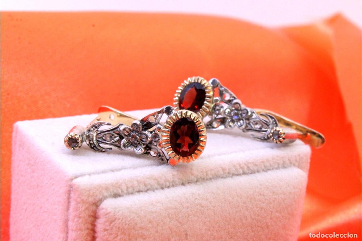 Gioielleria: Pendientes en oro y plata de 19,2K con diamantes y granates.