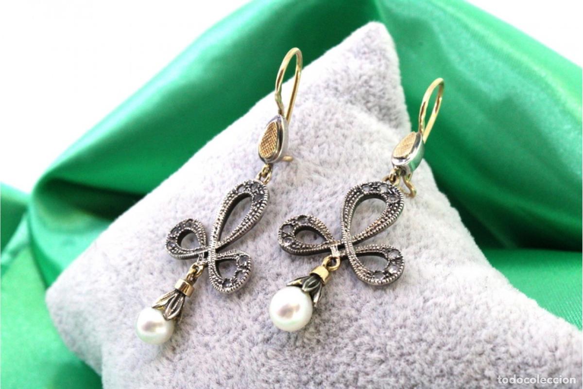 Gioielleria: Pendientes en oro de 19,2K y plata con perlas.