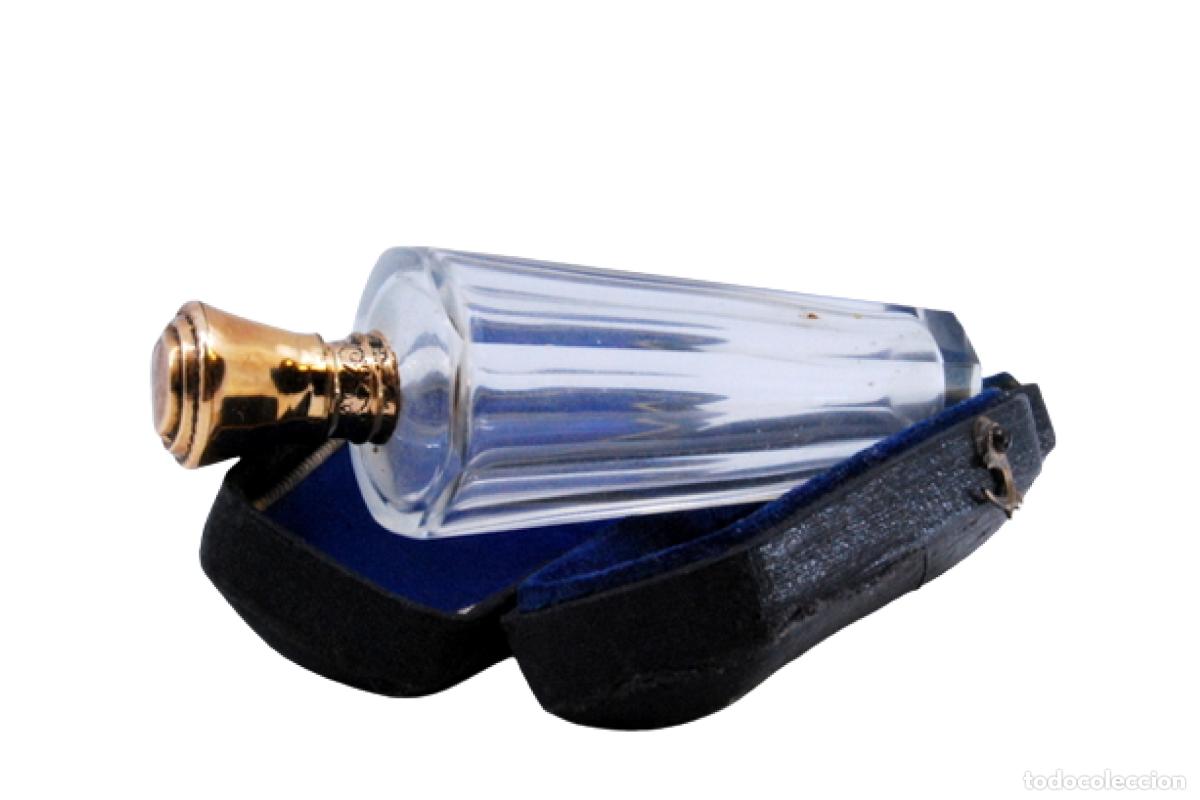 Schmuck: Frasco de perfume, fabricado en cristal y oro de 15K.