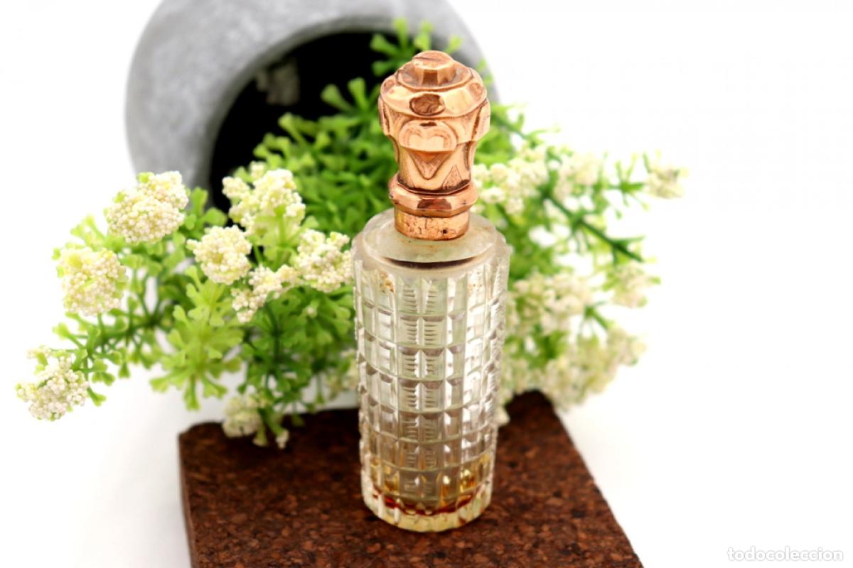 Schmuck: Frasco de perfume, fabricado en cristal y oro de 15K.