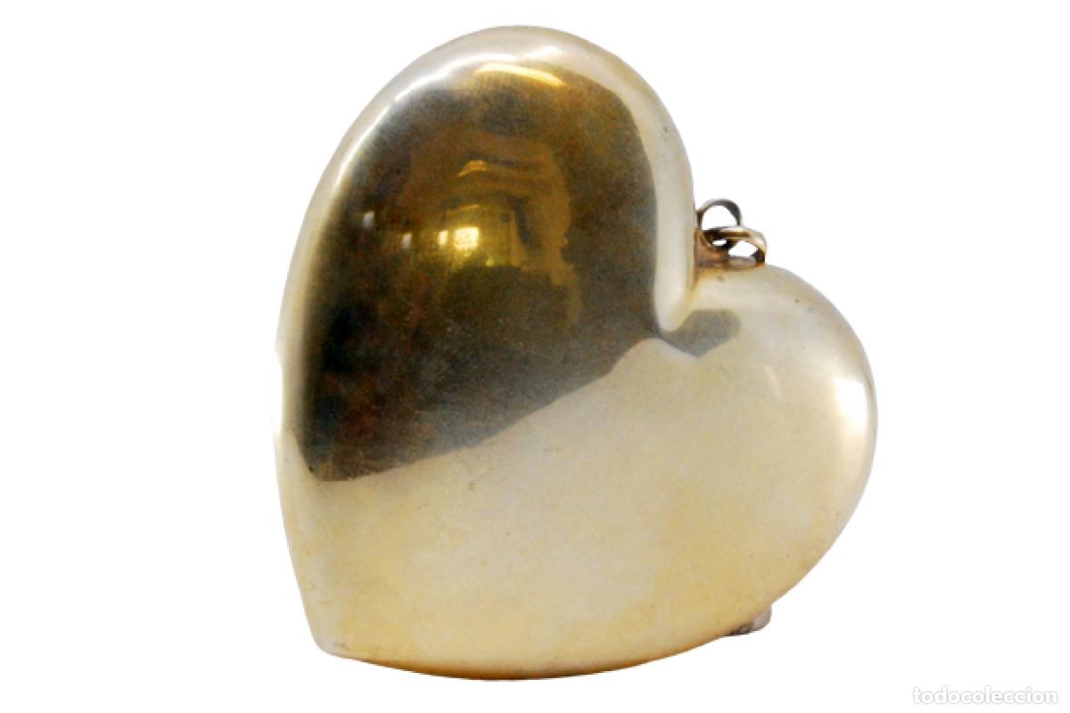 Gioielleria: Colgante en forma de coraz&oacute;n en plata ba&ntilde;ada en oro.