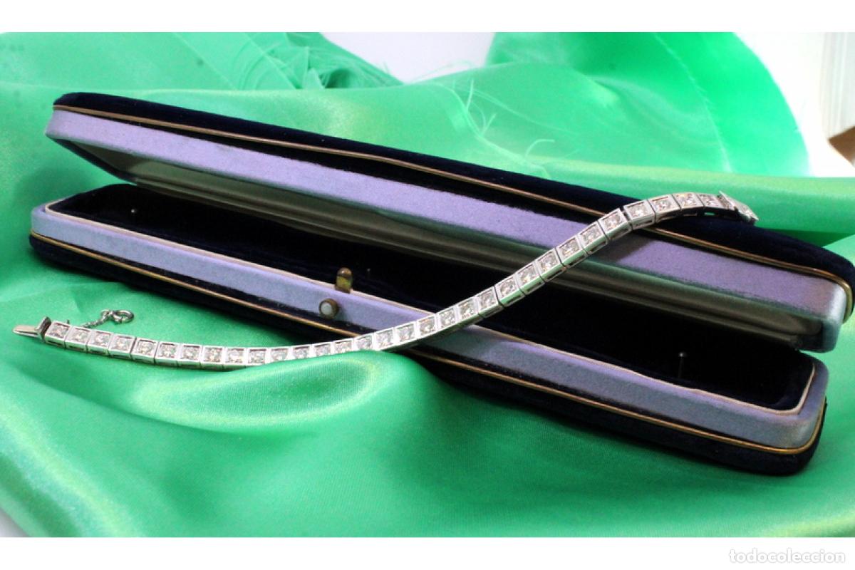 Joyeria: Pulsera riviera de platino con diamantes y rub&iacute;es.