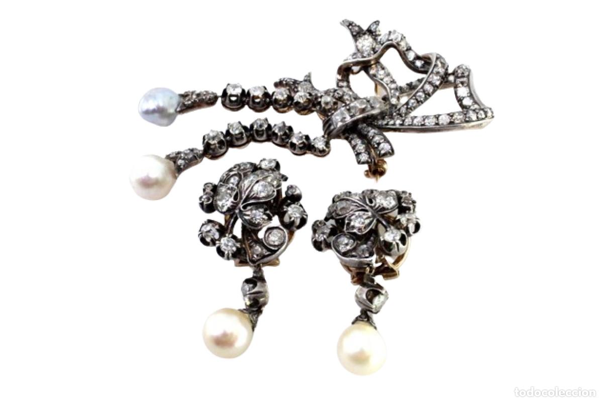 Schmuck: Conjunto de broche y pendientes en oro y plata de 19,2K con diamantes y perlas.