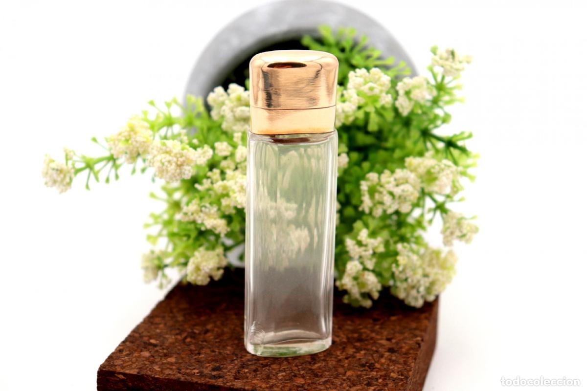 Schmuck: Frasco de perfume, fabricado en cristal y oro de 15K.