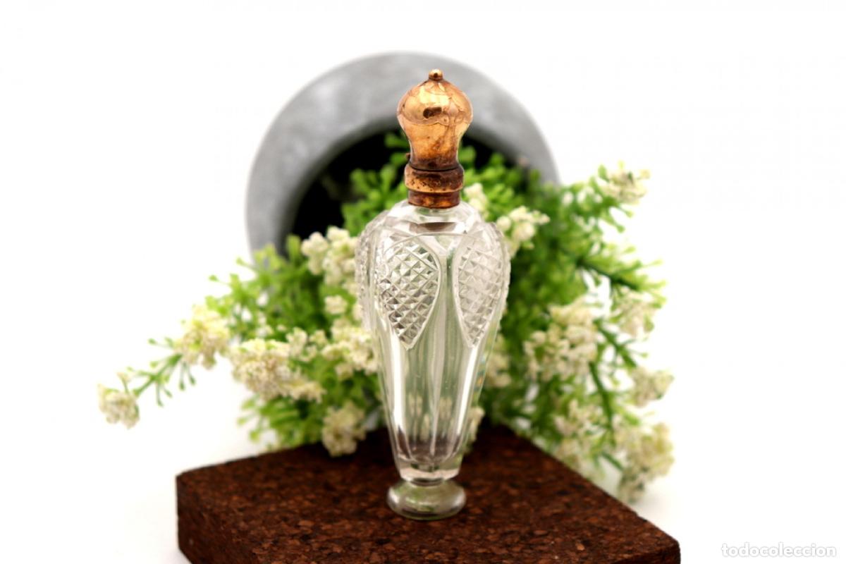 Schmuck: Frasco de perfume, fabricado en cristal y oro de 15K.