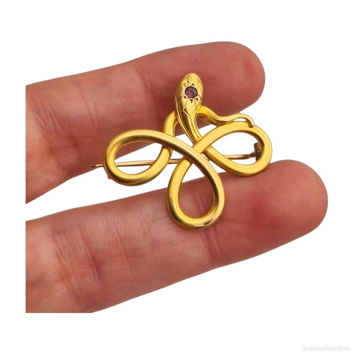Joyeria: Broche franc&eacute;s FIX con serpiente entrelazada., oro laminado y piedra roja circa 1910