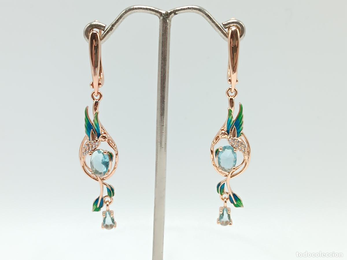 Joyeria: Elegantes pendientes largos en oro de 14k