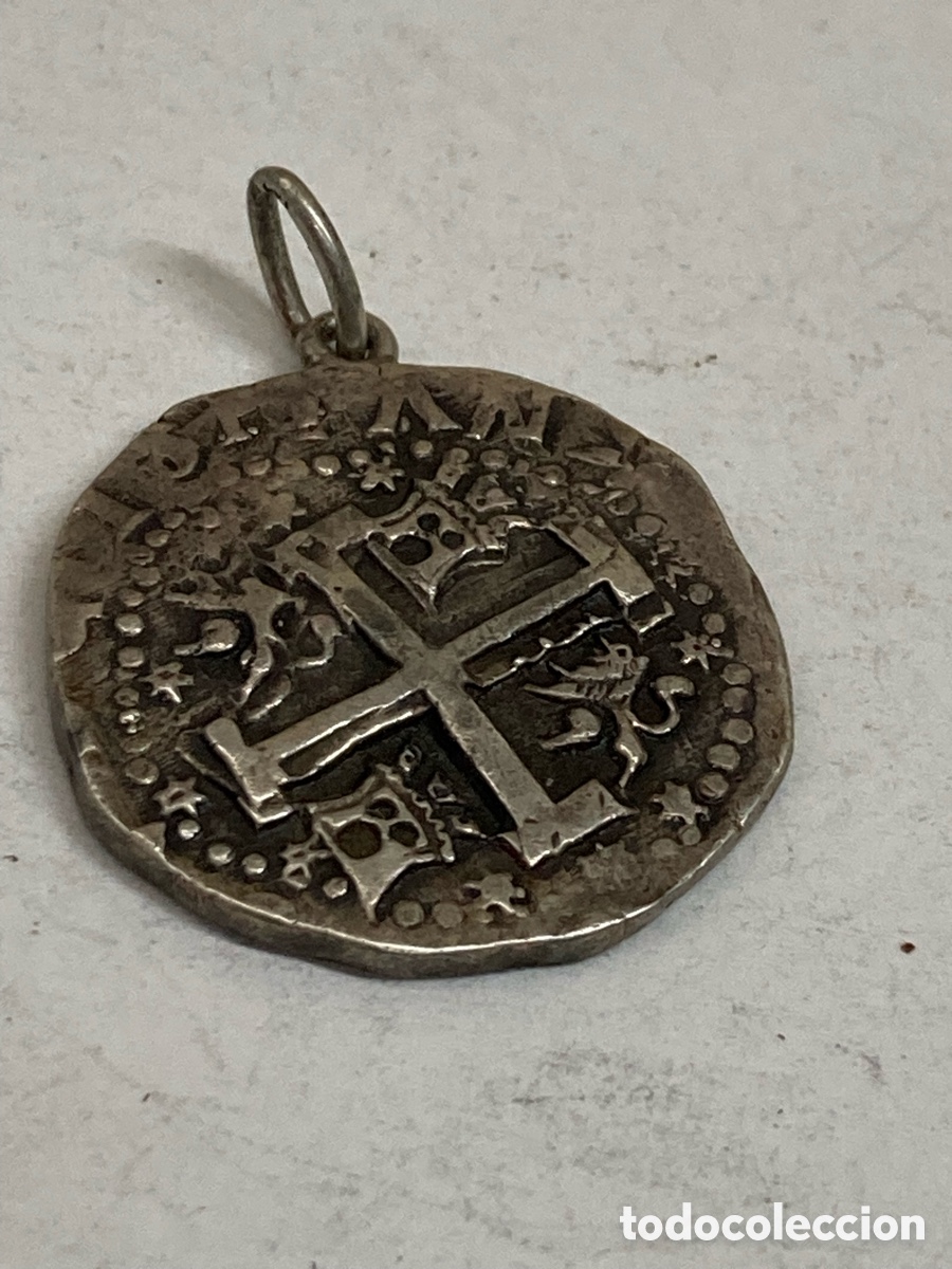 Joyeria: moneda de cospel irregular, convertida en colgante