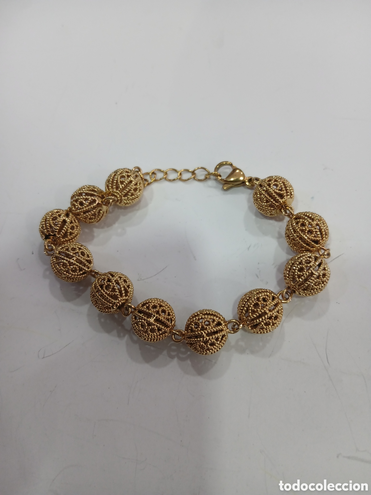 Schmuck: Pulsera dorada con filigrana. (L57)