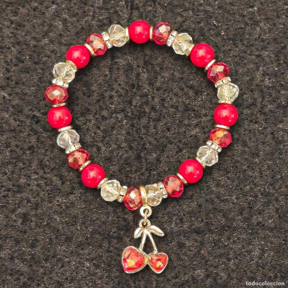 Joyeria: PULSERA ELASTICA PIEDRAS SWAROSKI BOLAS ROJAS CON DIJET FRESAS Y ALPACA PLATEADA