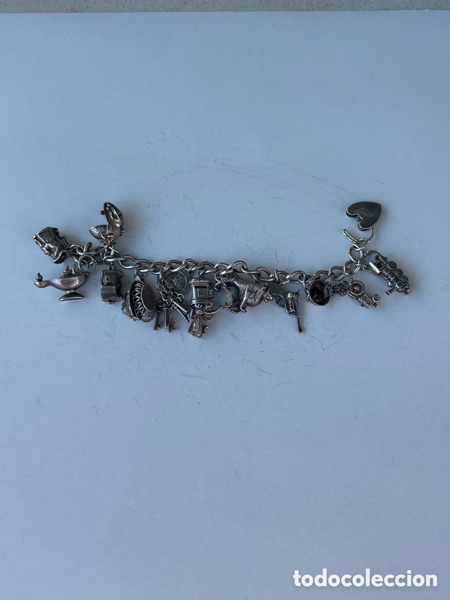 Joyeria: Pulsera vintage de plata inglesa con 15 dijes.