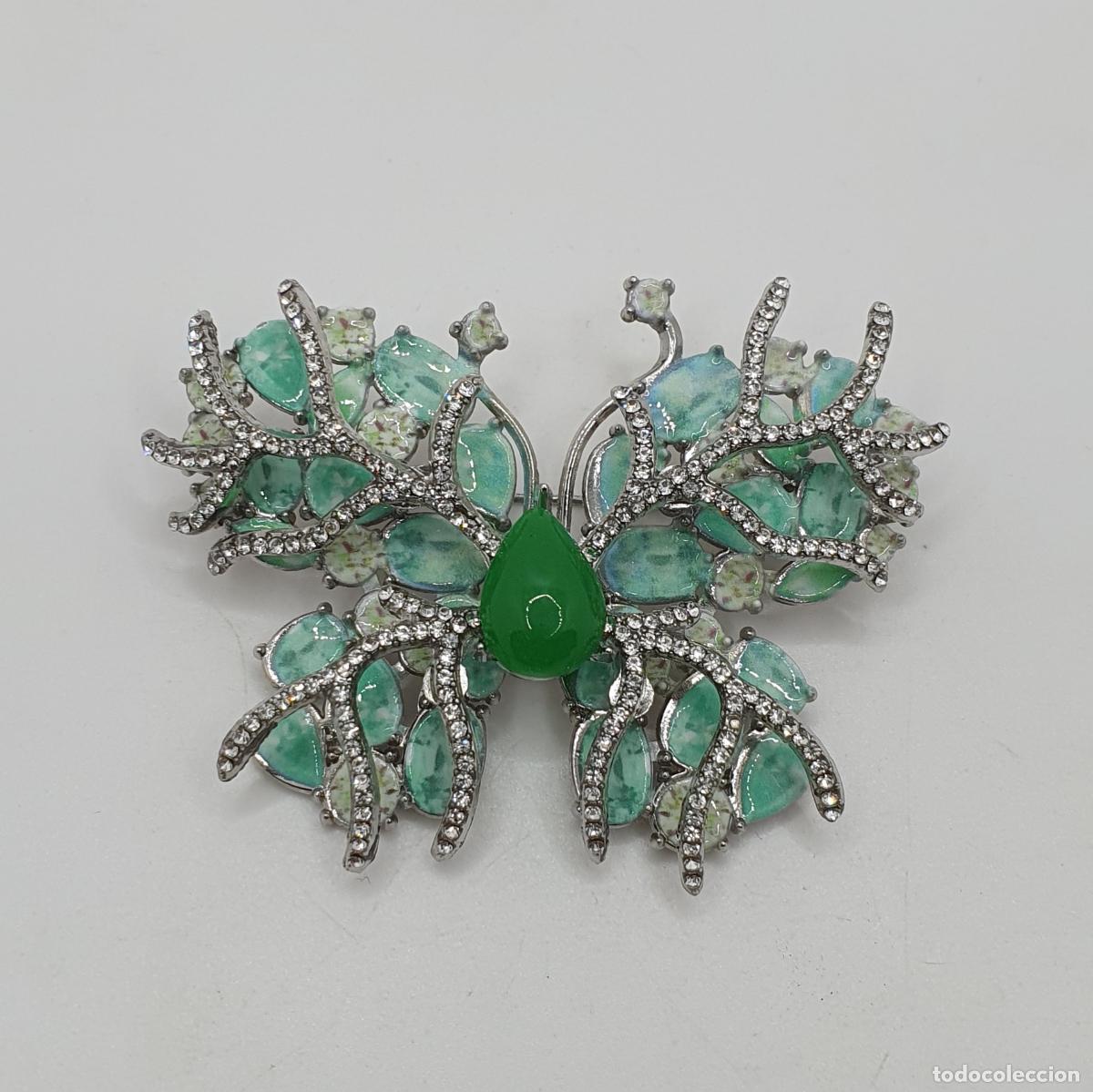 Gioielleria: Exuberante broche de mariposa de dise&ntilde;o exquisito con acabados en plata, esmaltes y circonitas.