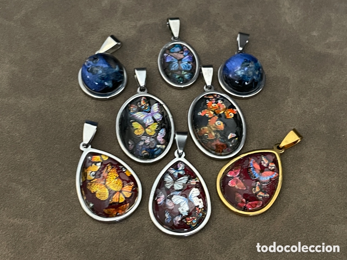 Joyeria: Lote de 8 medallas con motivos de mariposas