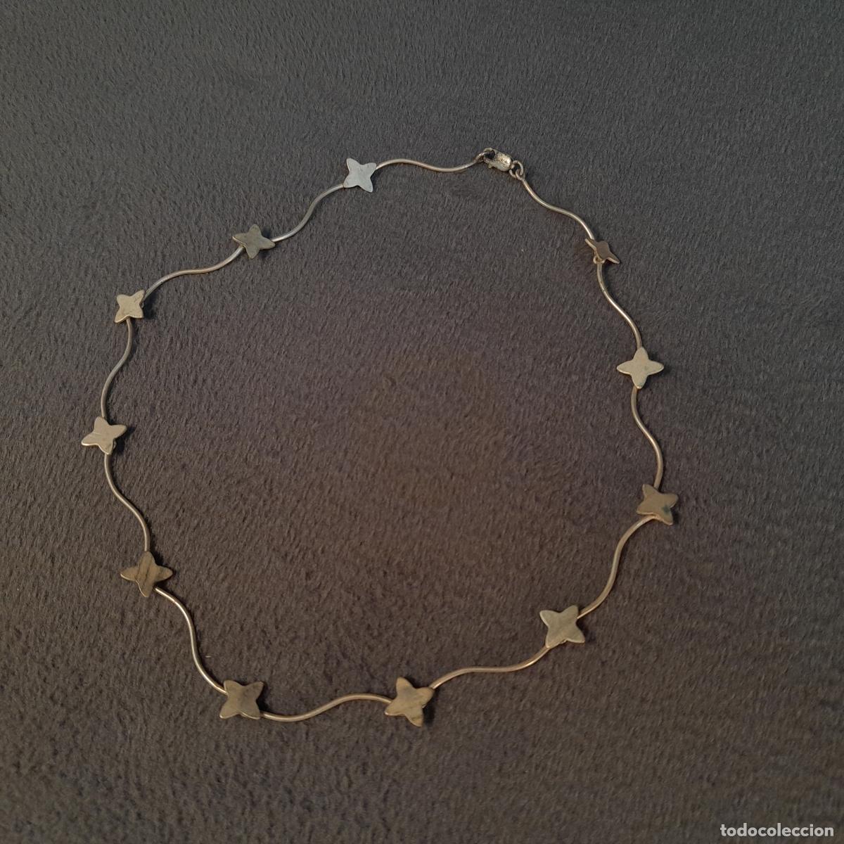 Joyeria: J-4486. COLLAR DE PLATA CON MOTIVOS DE ESTRELLA DE CUATRO PUNTAS. SIGLO XX