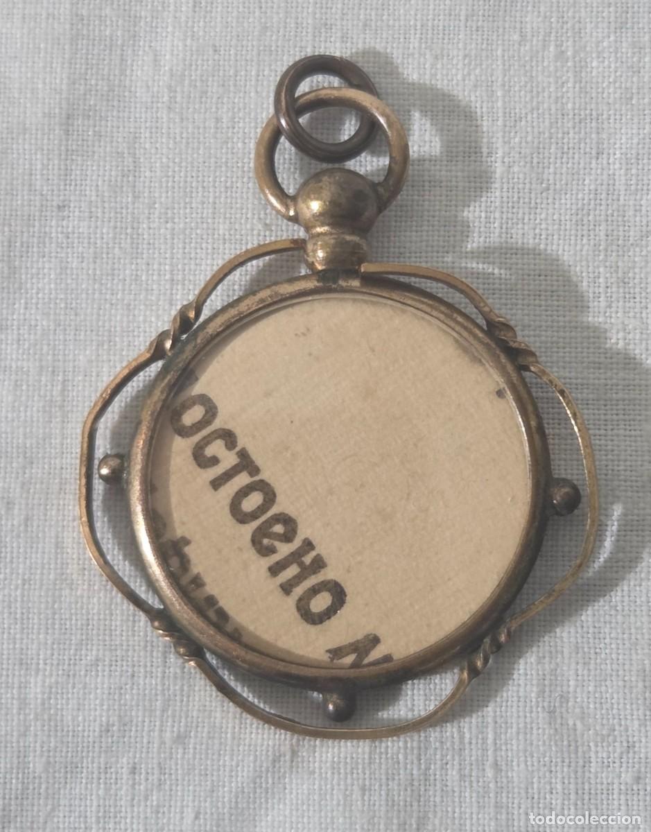 Joyeria: Colgante portafotos en metal dorado, finales siglo XIX principios XX