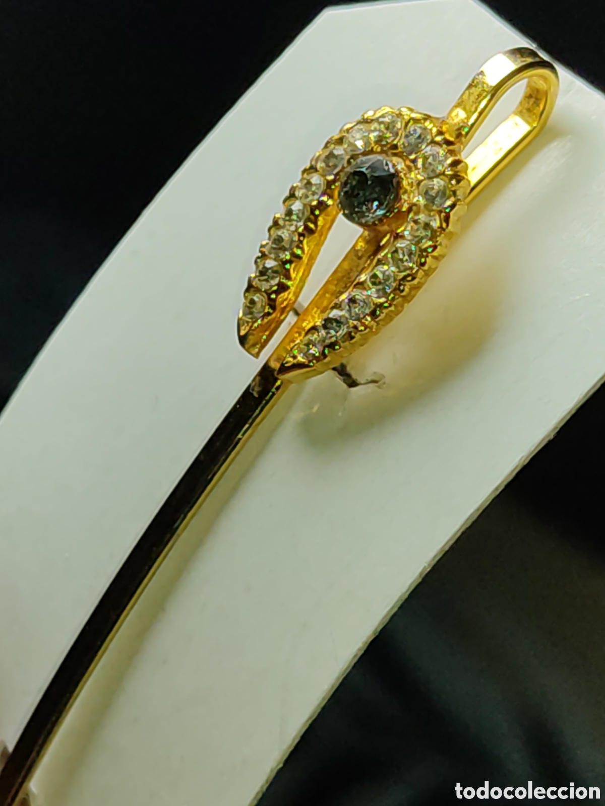 Joyeria: Horquilla de pelo herradura con circonitas o cristales.Chapado o ba&ntilde;o de oro,con contrastes.Vintage.