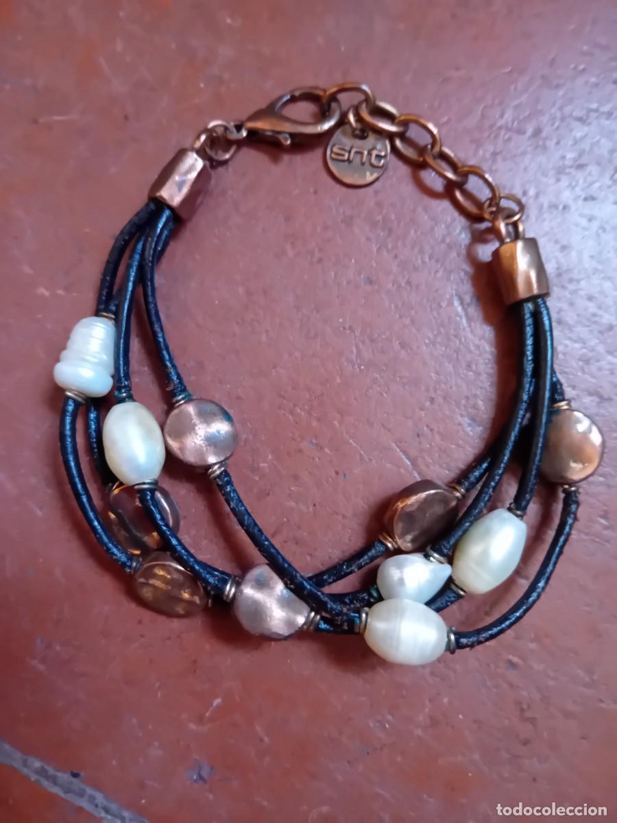 Joyeria: Pulsera marca SNT de perlas metal y cuero