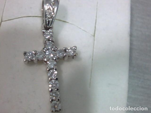 Joyeria: cruz en oro 18 kts y diamantes