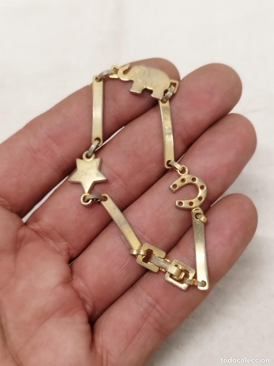 Joyeria: Antigua pulsera de amuletos. Herradura, elefante, estrella.