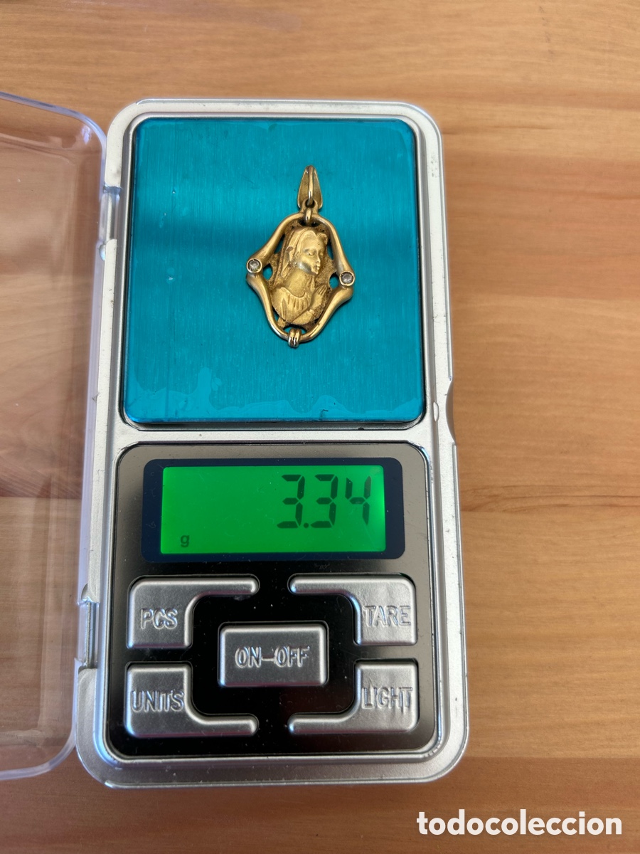 Joyeria: Medalla de oro de 18 kilates