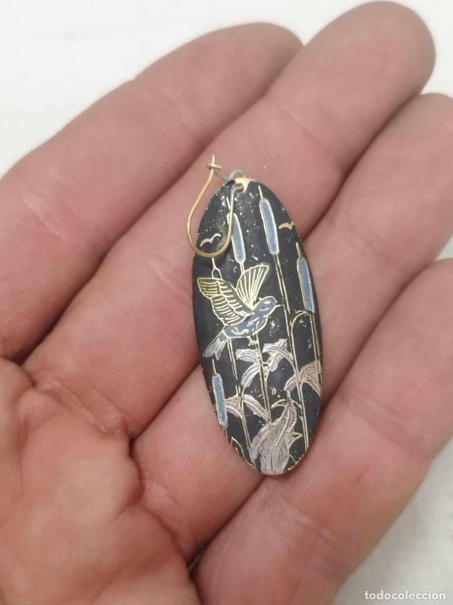 Joyeria: Antiguo pendiente, solo uno. De un pajaro tipo oriental.