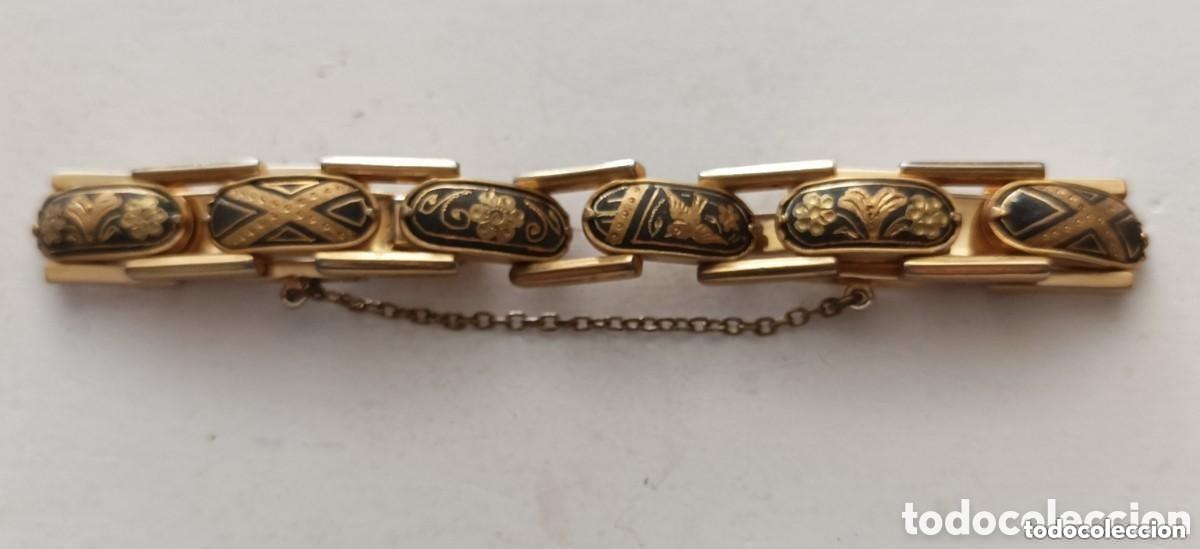 Joaillerie: Antigua pulsera damasquinada de 9 eslabones. 7 cm diametro