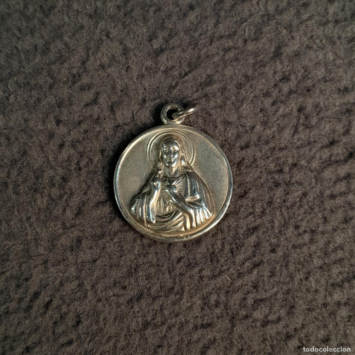 Jewelry: J-4523. COLGANTE DEVOCIONAL DE PLATA CON VIRGEN DE MONTSERRAT Y SAGRADO CORAZ&Oacute;N DE JES&Uacute;S. SIGLO XX
