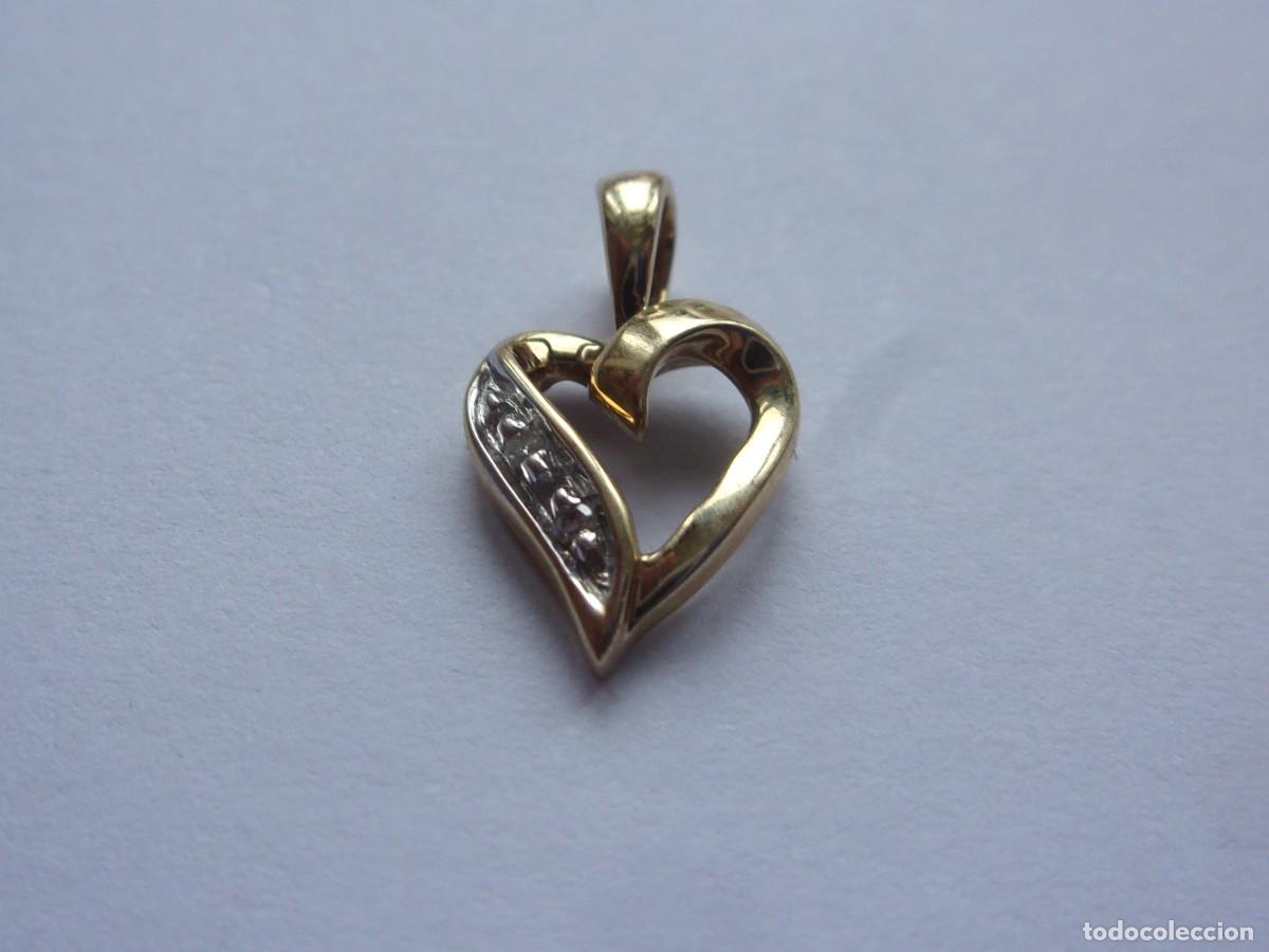 Joyeria: 46SAL10 Colgante de oro de 9 quilates con diamantes naturales. 0,6 gramos. 14,5x8,5 mm.