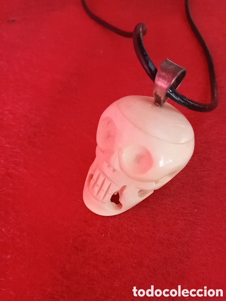 Joyeria: COLGANTE CALAVERA TALLADO EN HU&Eacute;SO